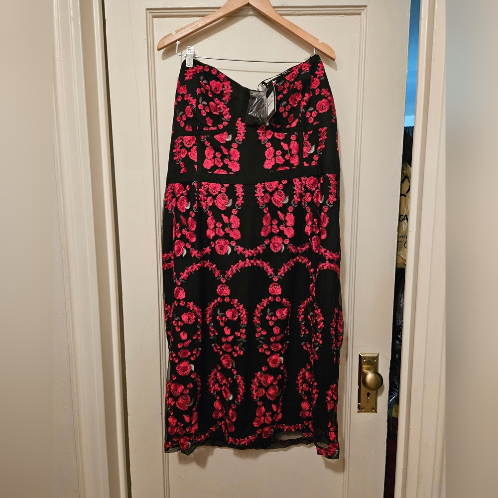 Women's cocktail dress strapless with strap to be attaches if desire.